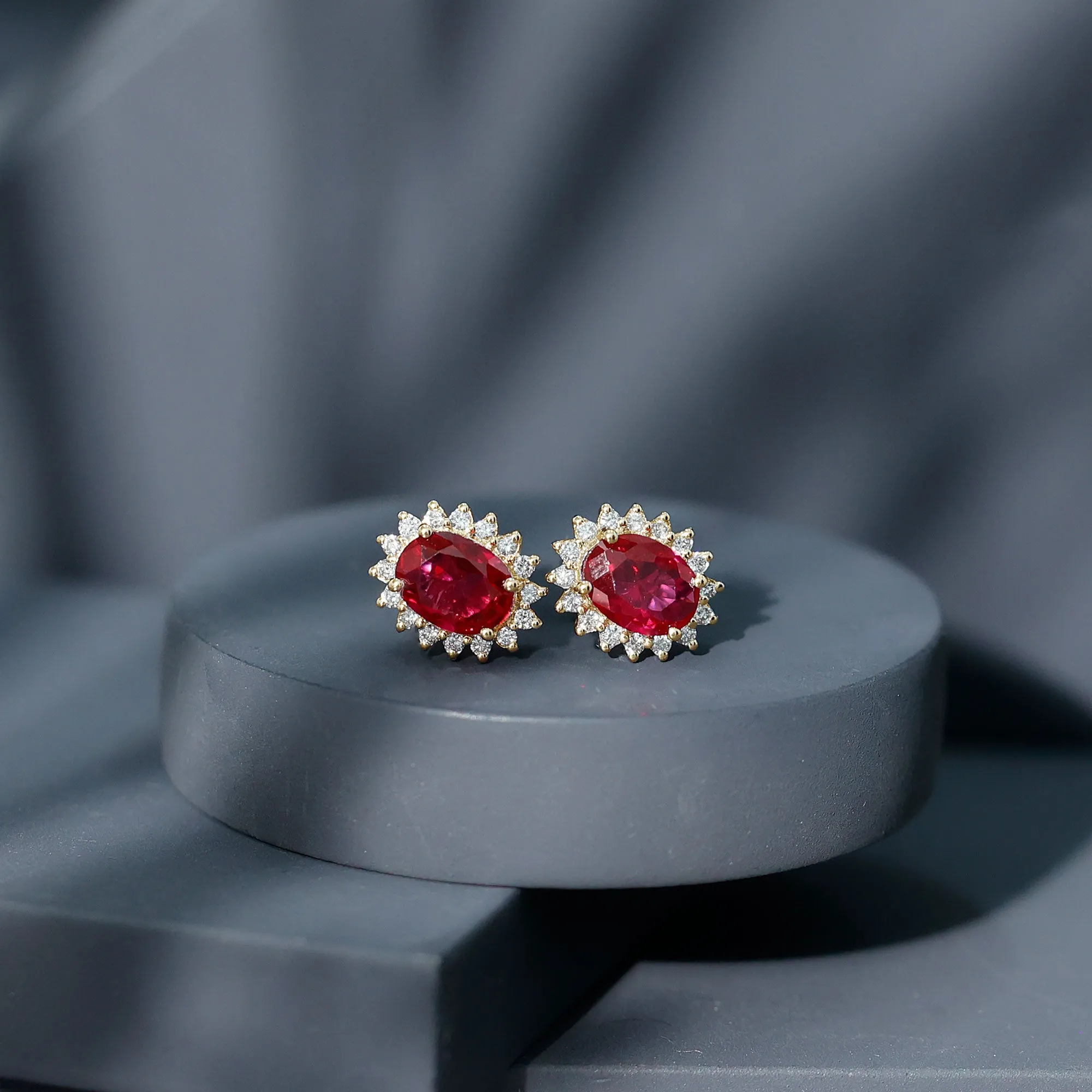 2.5 CT Oval Cut Created Ruby Statement Stud Earrings with Diamond Halo