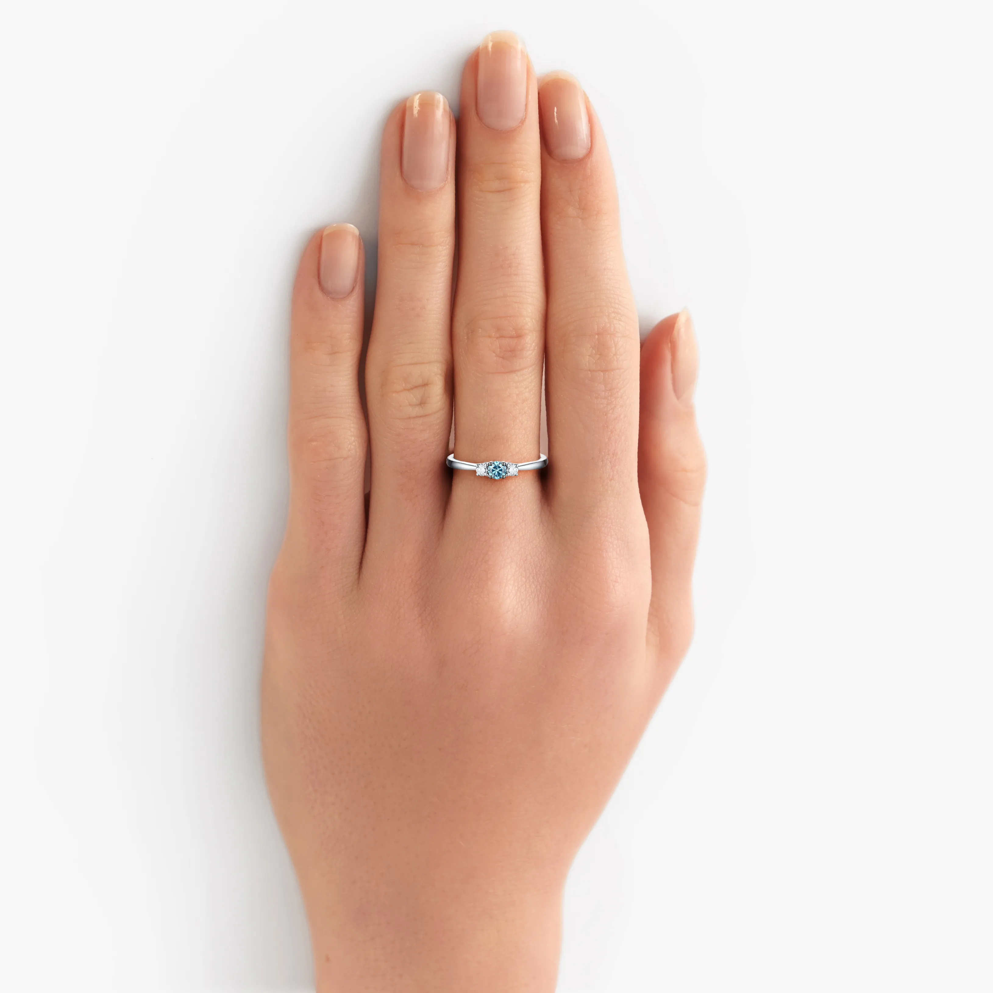 Blush blue three stone ring