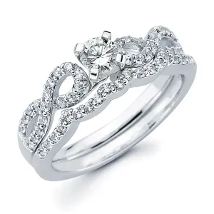 Modern Bridal: 1/4 Ctw. Diamond Infinity Semi Mount shown with 1/4 Ct. Round Center Diamond in 14K Gold